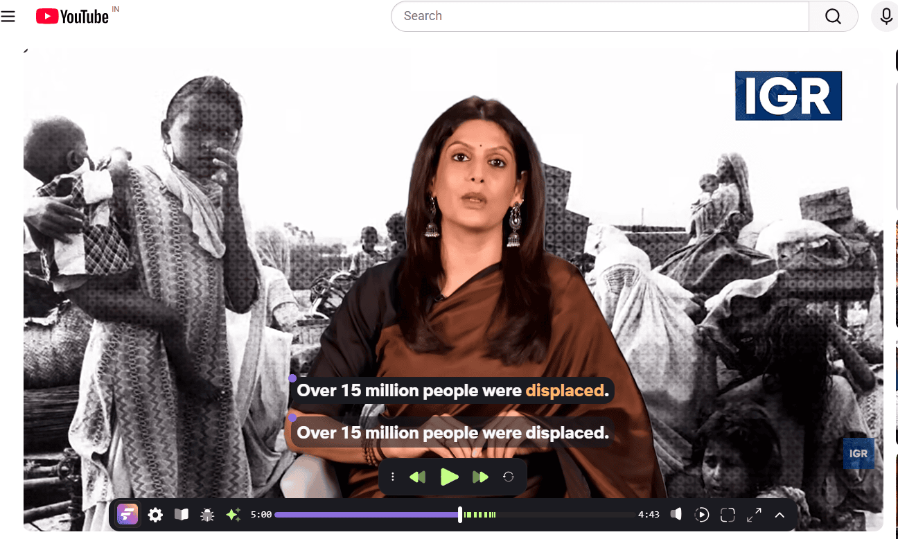 FluentAI dual language overlay on YouTube video