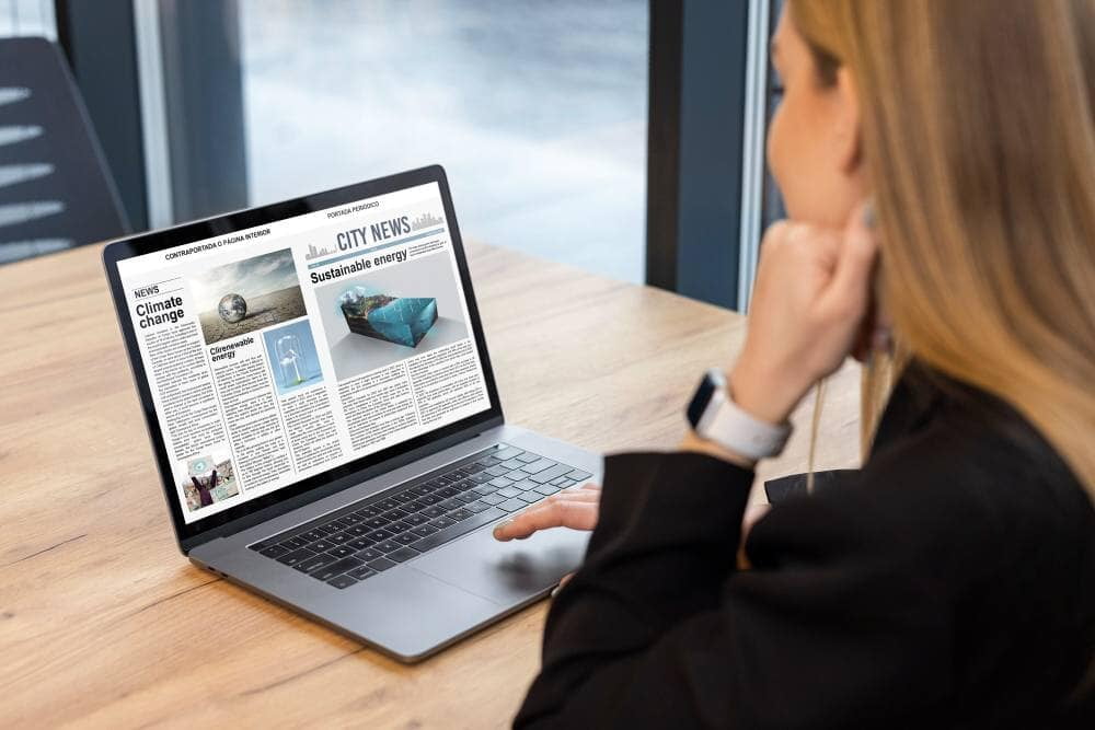 Reading news on a laptop